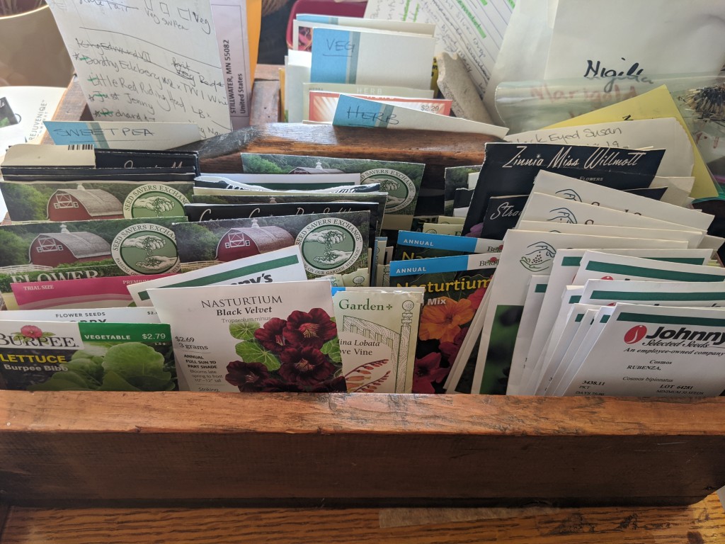 A box filled with diverse seed packets
